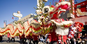 Chinese New Year celebrations in many communities include a dragon dance, like the one shown in this photograph. A team of performers carries an elaborate dragon puppet made of bamboo, paper, and silk, parading the colorful beast through the streets in an festive dance. The dragon symbolizes good luck, and the dance invites success in the coming year.