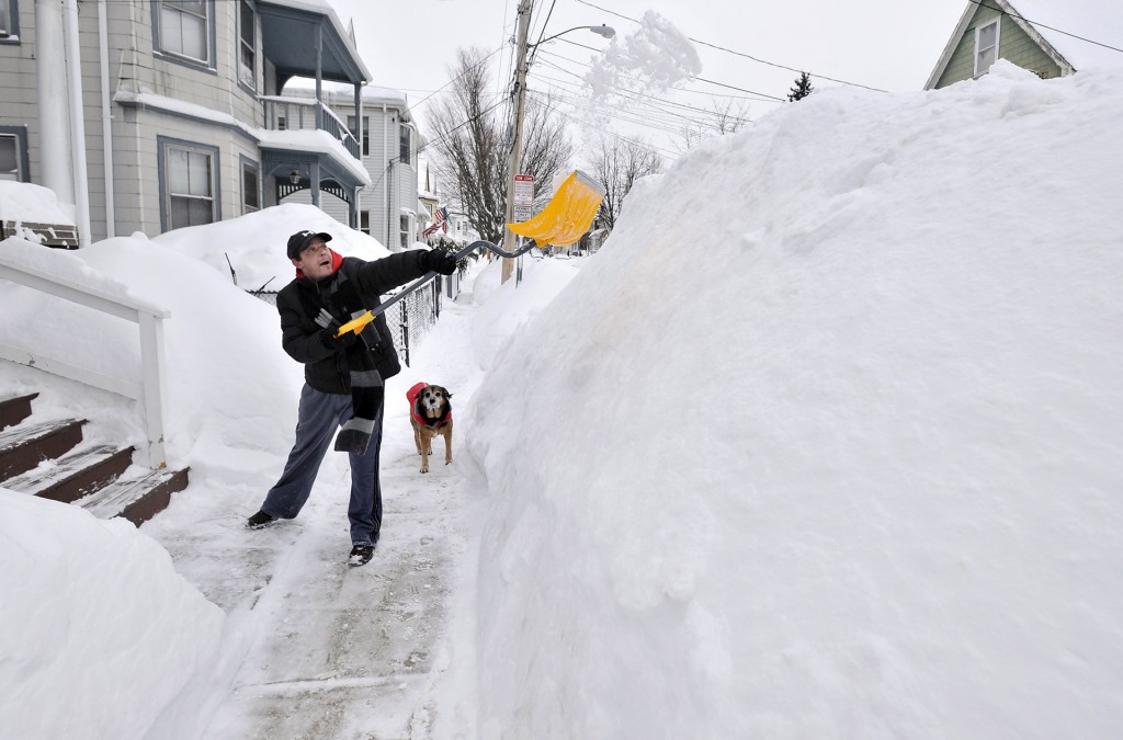 The latest snowstorm left the Boston area with another two feet of snow and forced the MBTA to suspend all rail service for the day. Credit: AP Photo