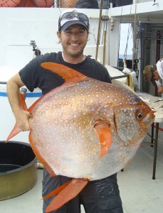 Southwest Fisheries Science Center biologist Nick Wegner holds captured opah. Credit: NOAA