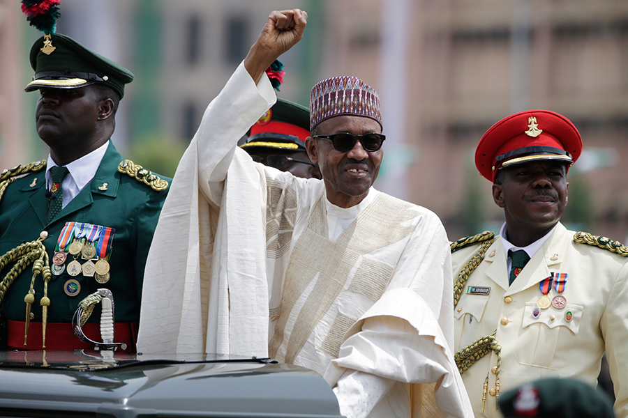 New Nigerian President, Muhammadu Buhari, salutes his supporters during his  Inauguration in Abuja, Nigeria, Friday, May 29, 2015. AP Photo/Sunday Alamba