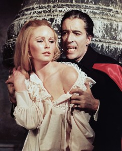Veronica Carlson, British actress, with Christopher Lee, British actor, as Lee goes on the attack in a publicity portrait issued for the film, 'Dracula Has Risen from the Grave', United Kingdom, 1968. The Hammer horror film, directed by Freddie Francis, starred Carlson as 'Maria Mueller', and Lee as 'Dracula'. (Credit: Silver Screen Collection/Moviepix/Getty Images)