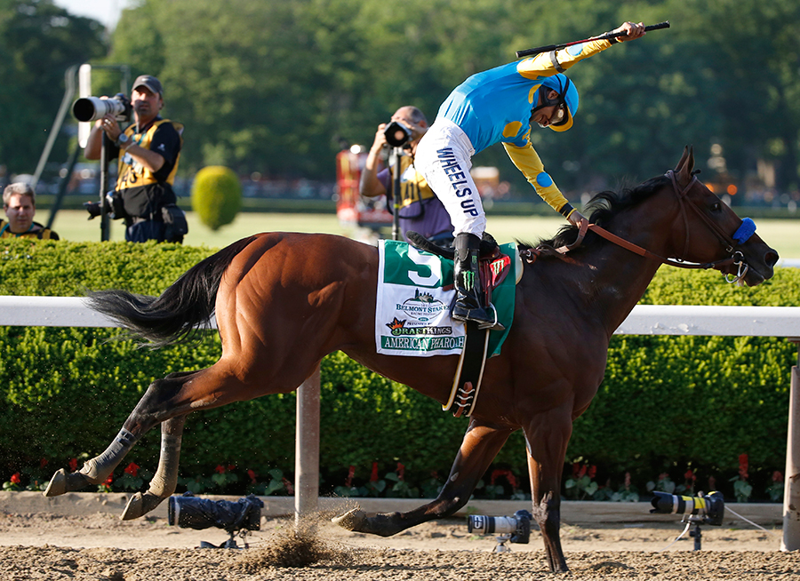 Victor Espinoza reacts after guiding American Pharoah across the finish line to win the 147th running of the Belmont Stakes horse race at Belmont Park, Saturday, June 6, 2015, in Elmont, N.Y. American Pharoah is the first horse to win the Triple Crown since Affirmed won it in 1978. (AP Photo/Kathy Willens)