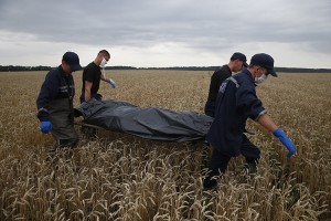 Members of the Ukrainian Emergency Ministry carry a body at the crash site of Malaysia Airlines Flight MH17, near the settlement of Grabovo in the Donetsk region July 19, 2014. Ukraine accused Russia and pro-Moscow rebels on Saturday of destroying evidence of "international crimes" from the wreckage of the Malaysian airliner that Kiev says militants shot down with a missile, killing nearly 300 people. Credit: © Maxim Zmeyev, Reuters/Landov