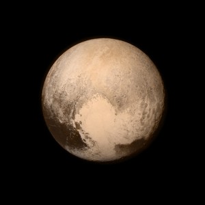 Pluto nearly fills the frame in this image from the Long Range Reconnaissance Imager (LORRI) aboard NASA's New Horizons spacecraft, taken on July 13, 2015, when the spacecraft was 476,000 miles (768,000 kilometers) from the surface. This is the last and most detailed image sent to Earth before the spacecraft's closest approach to Pluto on July 14. The color image has been combined with lower-resolution color information from the Ralph instrument that was acquired earlier on July 13. This view is dominated by the large, bright feature informally named the "heart," which measures approximately 1,000 miles (1,600 kilometers) across. The heart borders darker equatorial terrains, and the mottled terrain to its east (right) are complex. However, even at this resolution, much of the heart's interior appears remarkably featureless-possibly a sign of ongoing geologic processes. Credit: NASA/Johns Hopkins University Applied Physics Laboratory/Southwest Research Institute