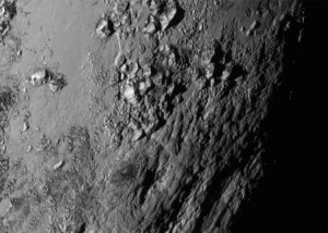 New close-up images of a region near Pluto’s equator reveal a giant surprise: a range of youthful mountains rising as high as 11,000 feet (3,500 meters) above the surface of the icy body. The mountains likely formed no more than 100 million years ago -- mere youngsters relative to the 4.56-billion-year age of the solar system -- and may still be in the process of building, says Geology, Geophysics and Imaging (GGI) team leader Jeff Moore of NASA’s Ames Research Center in Moffett Field, California.. That suggests the close-up region, which covers less than one percent of Pluto’s surface, may still be geologically active today. Moore and his colleagues base the youthful age estimate on the lack of craters in this scene. Like the rest of Pluto, this region would presumably have been pummeled by space debris for billions of years and would have once been heavily cratered -- unless recent activity had given the region a facelift, erasing those pockmarks. “This is one of the youngest surfaces we’ve ever seen in the solar system,” says Moore.     Unlike the icy moons of giant planets, Pluto cannot be heated by gravitational interactions with a much larger planetary body. Some other process must be generating the mountainous landscape.  “This may cause us to rethink what powers geological activity on many other icy worlds,” says GGI deputy team leader John Spencer of the Southwest Research Institute in Boulder, Colo. The mountains are probably composed of Pluto’s water-ice “bedrock.” Although methane and nitrogen ice covers much of the surface of Pluto, these materials are not strong enough to build the mountains. Instead, a stiffer material, most likely water-ice, created the peaks. “At Pluto’s temperatures, water-ice behaves more like rock,” said deputy GGI lead Bill McKinnon of Washington University, St. Louis. The close-up image was taken about 1.5 hours before New Horizons closest approach to Pluto, when the craft was 47,800 miles (77,000 kilometers) from the surface of the planet. The image easily resolves structures smaller than a mile across. Credit: NASA-JHUAPL-SwRI