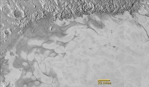 New Horizons discovers flowing ices in Pluto’s heart-shaped feature. In the northern region of Pluto’s Sputnik Planum (Sputnik Plain), swirl-shaped patterns of light and dark suggest that a surface layer of exotic ices has flowed around obstacles and into depressions, much like glaciers on Earth. Credit: NASA/JHUAPL/SwRI