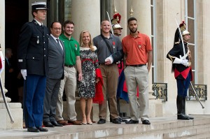 French President, Francois Hollande (L) receives US-France Ambassador, Jane Hartley (C) and honorees at the Elysee Palace on August 24, 2015, in Paris, France. Spencer Stone (in an orange shirt), Anthony Sadler (in grey) and Alek Skarlatos (in green) were awarded the Legion d'Honneur (Legion of Honor) after overpowering a gunman on a high-speed train after he opened fire on travelers. (Credit: © Aurelien Meunier, Getty Images)