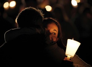 Umpqua Community College student is consoled during a candlelight vigil for those killed during a shooting at the school, Thursday, Oct. 1, 2015, in Roseburg, Ore. Credit: © Rich Pedroncelli, AP Photo