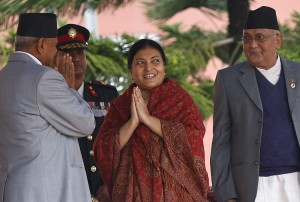 Nepal's first elected female president Bidhya Bhandari (C) is congratulated by outgoing President Ram Baran Yadav (L) while Prime Minister KP Sharma Oli (R) looks on after taking her oath in a ceremony at the presidential office in Kathmandu, Nepal, 29 October 2015. Bhandari who is the widow of the deceased chairman of the Communist Party of Nepal-Unified Marxist-Leninist (UML) Madan Bhandari, won 327 votes to beat her competitor Kulbahadur Gurung, who got 214 votes, to secure the largely ceremonial post. Credit: © Narendra Shrestha, EPA/Landov 
