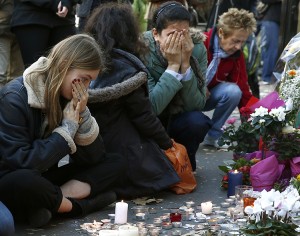 Mourners pay their respects at one of the attack sites in Paris, November 15, 2015. Credit: © Benoit Tessier, Reuters/Landov