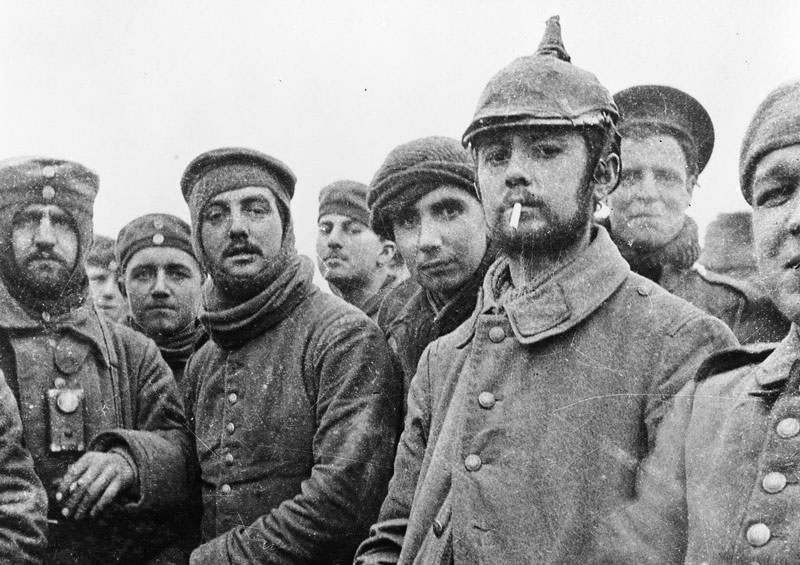 British and German soldiers fraternising at Ploegsteert, Belgium, on Christmas Day 1914, front of 11th Brigade, 4th Division. Possibly Riflemen Andrew (middle) and Grigg (second from the right, background) of the London Rifle Brigade with troops of the 104th and 106th Saxon Regiments. Credit: © Imperial War Museum