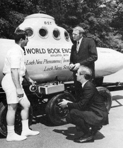 The submarine builder and pilot Dan Taylor, Jr., the biologist Roy Mackal, and World Book Vice President Harry Reucking confer in front of the submarine Viperfish shortly before its launch in 1969. World Book sponsored the submarine in its hunt for the Loch Ness monster. Credit: WORLD BOOK photo