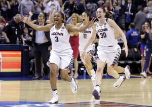 Connecticut's Morgan Tuck (3), Kia Nurse (11), and Breanna Stewart (30) celebrate after Connecticut's victory over Syracuse in the championship game at the women's Final Four on April 5, 2016.  Credit: © Michael Conroy, AP Photo