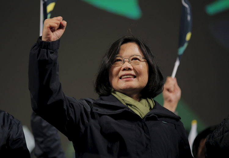 Democratic Progressive Party (DPP) Chairperson and presidential candidate Tsai Ing-wen gestures to her supporters after her election victory at party headquarters in Taipei, Taiwan January 16, 2016. Credit: © Damir Sagolj, Reuters