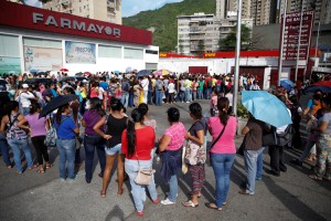 People line up to try to buy toilet paper and diapers outside a pharmacy in Caracas, Venezuela, on May 16, 2016. Credit: © Carlos Garcia Rawlins, Reuters