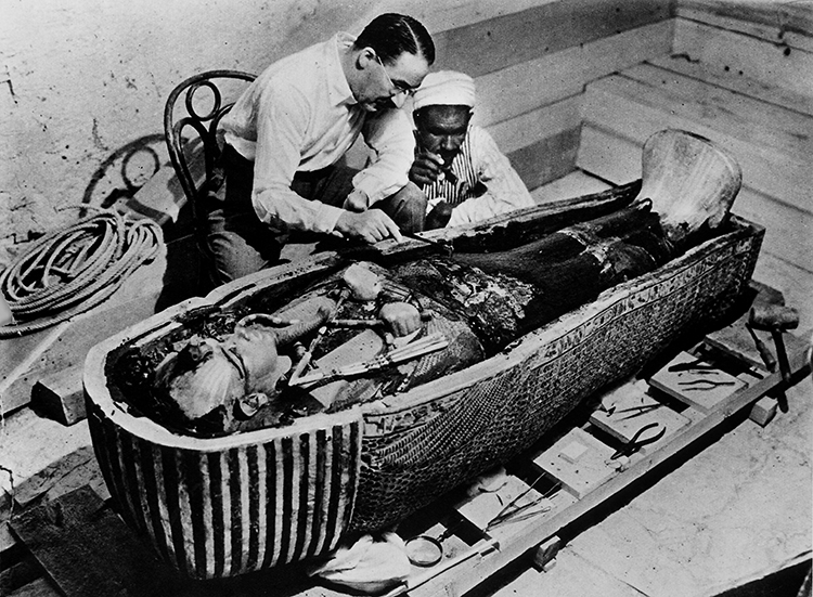 Archaeologist Howard Carter works with Tutankhamun’s mummy in 1922. Among the many riches from Tut's tomb was a rare iron-bladed dagger probably made from the metal of a meteorite. CREDIT: © Time & Life Pictures/Getty Images