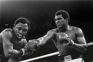 Muhammad Ali, at right, slugs Joe Frazier during their 1975 title bout. Ali was often referred to as the Champ, or, simply, the Greatest.  CREDIT: AP Photo