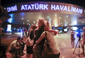 Passengers console one another outside Istanbul Atatürk Airport in the hours after a terror attack killed 41 people on June 28, 2016. Credit: © Emrah Gurel, AP Photo