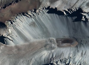 The extreme landscape around Antarctica's Don Juan Pond (the black pool in the right of the photograph) resembles a lunar or Martian scene more than a glimpse of our own planet Earth. Credit: NASA/Goddard Space Flight Center Scientific Visualization Studio/Landsat 7 Project Science Office/MODIS Rapid Response Team