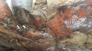 Rock art depicting warring Aboriginal peoples holding shields, clubs, and boomerangs was discovered close to Kaakutja’s burial site. Credit: © Antiquity Publications
