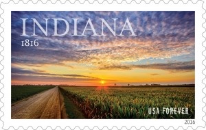 A stunning photograph taken at sunset over cornfields in Milford, IN, by a young photographer raised there was selected as the Forever stamp to celebrate Indiana’s 200th statehood anniversary. Indiana became the 19th state of the Union Dec., 11, 1816. Celebration festivities will take place throughout the year. The Indiana Statehood Forever Stamp was issued today at the state capitol in Indianapolis. Indiana Governor Mike Pence helped dedicate the stamp. Credit: United States Postal Service