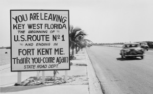 Photograph of a road sign along the highway in Key West, Florida, announcing the beginning of U.S. Route 1 to Fort Kent, Maine, March 195. Credit: National Archives
