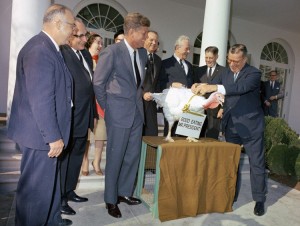 President John F. Kennedy laughs with officials at the presentation of a Thanksgiving turkey by the National Turkey Federation and the Poultry and Egg National Board in the Rose Garden of the White House on November 19, 1963. President Kennedy pardoned the turkey stating "Let's Keep him going." Credit: National Archives