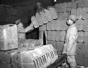 Red Ball Express troops stack "jerry cans" used to transport gas to front-line units during World War II. Credit: Army Transportation Museum