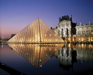 The Louvre is one of the largest and most famous art museums in the world. It stands along the Seine River. The main building, background, was once a royal palace. The modern entrance, foreground, was added in the 1980's. The American architect I. M. Pei designed the glass pyramid. Credit: © SuperStock