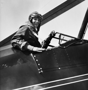 Amelia Earhart, a pioneering American aviator, became the first woman to fly across the Atlantic Ocean alone. Earhart, shown here in the cockpit of an airplane, undertook the flight in 1932. Credit: © Corbis/Bettmann