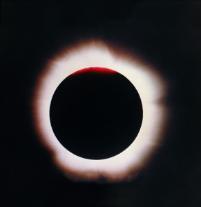 A solar eclipse occurs when the moon passes between Earth and the sun, blotting out the sun's light. This photograph shows a total eclipse, in which the moon completely covers the face of the sun. The sun's outer atmosphere, called the corona appears as an irregularly shaped halo of light. Credit: 