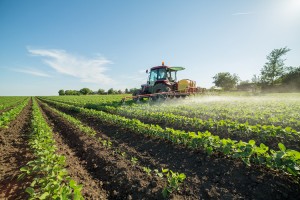 Farmer spraying soybean field with herbicides. Credit: © Shutterstock