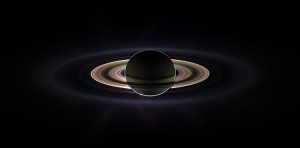 With giant Saturn hanging in the blackness and sheltering Cassini from the sun's blinding glare, the spacecraft viewed the rings as never before, revealing previously unknown faint rings and even glimpsing its home world. This marvelous panoramic view was created by combining a total of 165 images taken by the Cassini wide-angle camera over nearly three hours on Sept. 15, 2006. The full mosaic consists of three rows of nine wide-angle camera footprints; only a portion of the full mosaic is shown here. Color in the view was created by digitally compositing ultraviolet, infrared and clear filter images and was then adjusted to resemble natural color. Credit: NASA/JPL/Space Science Institute