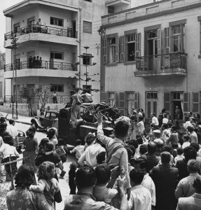 Jews paraded a captured Arab vehicle through Tel Aviv on May 14, 1948, the day the Jewish state of Israel was established in the historic region of Palestine. Zionists (Jewish nationalists) and Palestinian Arabs were fighting over the region, which they both claimed. Israelis and Palestinians continue to struggle over the region. Credit: © Corbis/Hulton-Deutsch Collection