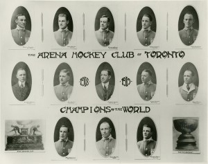 This 1918 Toronto Arenas team composite shows the players and staff (and earned hardware) of the first NHL Stanley Cup champion team. Team photo of the Arena Hockey Club of Toronto, a.k.a Toronto Arenas, O'Brien Cup and Stanley Cup Champions for the 1917–18 season. Top row, left to right: Russell "Rusty" Crawford, Harry Meeking, Ken Randall, Corbett Denneny and Harry Cameron. Middle row: coach Richard "Dick" Carroll, Jack Adams, team manager Charles Querrie, Alf Skinner, trainer Frank Carroll. Bottom row: Harry Mummery, Harry "Hap" Holmes and Reg Noble. Credit: Public Domain