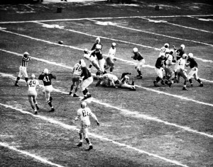 The Chicago Cardinals’ Billy Dewell (41, at left) chases a pass from quarterback Paul Christman (44, at right) during the team’s 28-21 victory over the Eagles in the 1947 NFL Championship Game at Comiskey Park in Chicago. Philadelphia football championship game at Comiskey Park Sunday between the Chicago Cardinals and the Philadelphia Eagles.  Cardinals won 28-21.  Photo shows: pass from Paul Christman (44), to Billy Dewell (41). Credit: © Bettmann/Getty Images