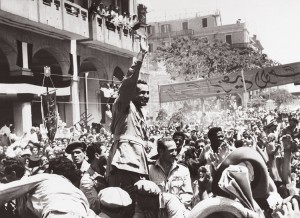 Egyptian President Gamal Abdel Nasser acknowledges the acclaim of cheering supporters as he drives through Port Said, Egypt, on his way to the Navy House where he will hoist the Egyptian flag, June. 18, 1956. Credit: © AP Photo