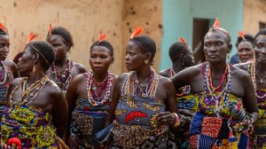 OUIDAH, BENIN - Jan 10, 2017: Unidentified Beninese women in national suit wear necklace and earings at the voodoo festival, which is anually celebrated on January, 10th. Credit: © Anton Ivanov, Shutterstock