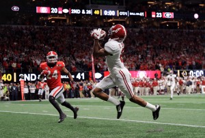 DeVonta Smith #6 of the Alabama Crimson Tide catches a 41 yard touchdown pass to beat the Georgia Bulldogs in the CFP National Championship presented by AT&T in overtime at Mercedes-Benz Stadium on January 8, 2018 in Atlanta, Georgia. Credit: © Mike Ehrmann, Getty Images