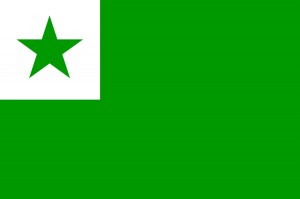The Esperanto flag is composed of a green background with a white square (canton) in the upper lefthand corner, which in turn contains a green star. The green field symbolizes hope, the white symbolizes peace and neutrality, and the five-pointed star represents the five continents (Europe, America, Asia, Oceania, Africa).  The flag of the neutral international language Esperanto and the movement associated with it. Credit: Public Domain
