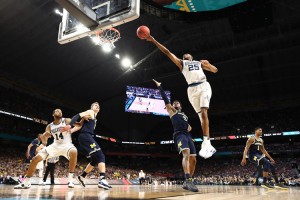 Mikal Bridges #25 of the Villanova Wildcats drives to the basket against Zavier Simpson #3 of the Michigan Wolverines in the second half during the 2018 NCAA Men's Final Four National Championship game at the Alamodome on April 2, 2018 in San Antonio, Texas. Credit: © Ronald Martinez, Getty Images