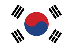 The flag of South Korea features a circular emblem on a white background, with black symbols in each corner. The circular emblem, which is half red and half blue, represents the balance between complementary forces in nature. The white background stands for peace. The symbols in the corners come from an ancient Chinese book of philosophy called the I Ching. They represent four traditional elements—heaven, water, earth, and fire. They also represent the four cardinal directions and the four seasons. Credit: © Archivector/Shutterstock