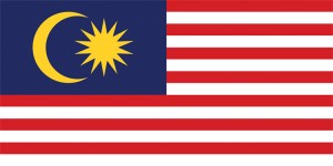 The flag of Malaysia has 14 horizontal stripes—7 red and 7 white. In the upper corner nearest the flagpole is a blue field with a yellow crescent and star. The stripes and the star represent Malaysia's 13 states and the federal government. The crescent is a symbol of Islam, the majority religion of Malaysia. The color blue symbolizes the unity of the Malaysian people. The color gold represents the nation's royal rulers. Credit: © PhotoRoman/Shutterstock