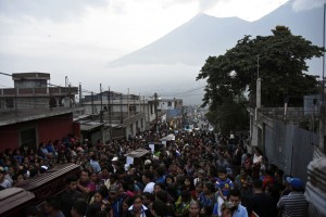 Residents of the village of Sacatepequez, Gautemala, carry the coffins of people killed in the violent eruption of the nearby Volcán de Fuego on June 4, 2018. Residents carry the coffins of seven people who died following the eruption of the Fuego volcano, along the streets of Alotenango municipality, Sacatepequez, about 65 km southwest of Guatemala City, on June 4, 2018. - Rescue workers Monday pulled more bodies from under the dust and rubble left by an explosive eruption of Guatemala's Fuego volcano, bringing the death toll to at least 62.  Credit: © Johan Ordonez, AFP/Getty Images