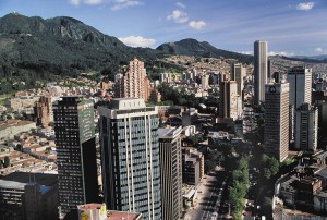 Bogotá, the capital and largest city of Colombia, lies in a basin high in the Andes Mountains. Steep mountains rise east of the city, providing a dramatic setting. High-rise office buildings and treelined streets grace the city center. Credit: © Stone from Getty Images 