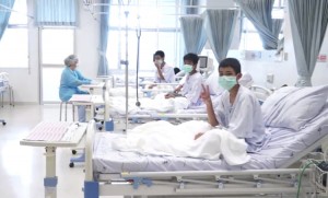 In this image made from video, released by the Thailand Government Spokesman Bureau, three of the 12 boys are seen recovering in their hospital beds after being rescued along with their coach from a flooded cave in Mae Sai, Chiang Rai province, northern Thailand. Credit: Thailand Government Spokesman Bureau