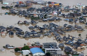 This picture shows an aerial view of flooded houses in Kurashiki, Okayama prefecture on July 8, 2018. - Japan's Prime Minister Shinzo Abe warned on July 8 of a 'race against time' to rescue flood victims as authorities issued new alerts over record rains that have killed at least 48 people.  Credit: © STR/AFP/Getty Images