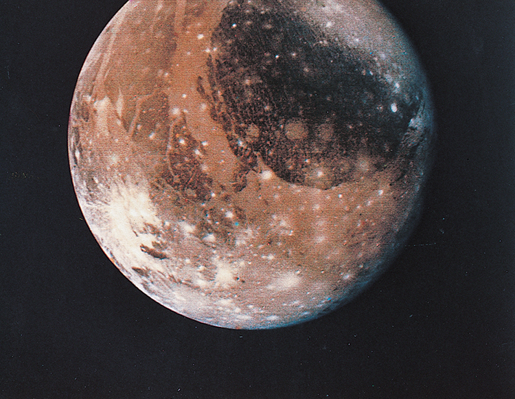 Ganymede, a moon of Jupiter, has craters and cracks on its surface. Asteroids and comets that hit Ganymede made the craters. The cracks are due to expansion and contraction of the surface. Credit: NASA 