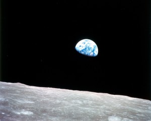 This view of Earth greeted the Apollo 8 astronauts in December 1968 as their craft emerged from behind the moon. The lunar surface can be seen in the foreground. Earth is one of eight planets that revolve around the sun. Credit: NASA 
