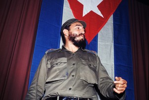 Fidel Castro stands in front of a Cuban flag in a photo from 1966. Castro headed his country's Communist government from 1959 to 2008. Credit: AP Photo 